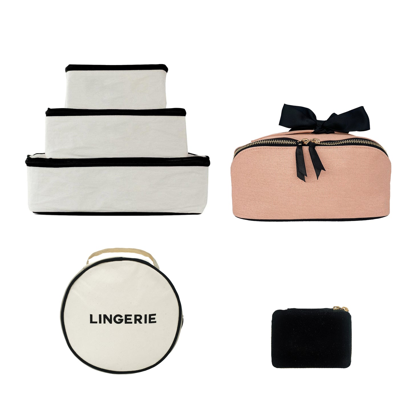 Bag-all Organized Traveler Essentials 4-set featuring stackable white storage cubes, pink cosmetic case with bow, round lingerie case, and black mini pouch for stylish travel organization