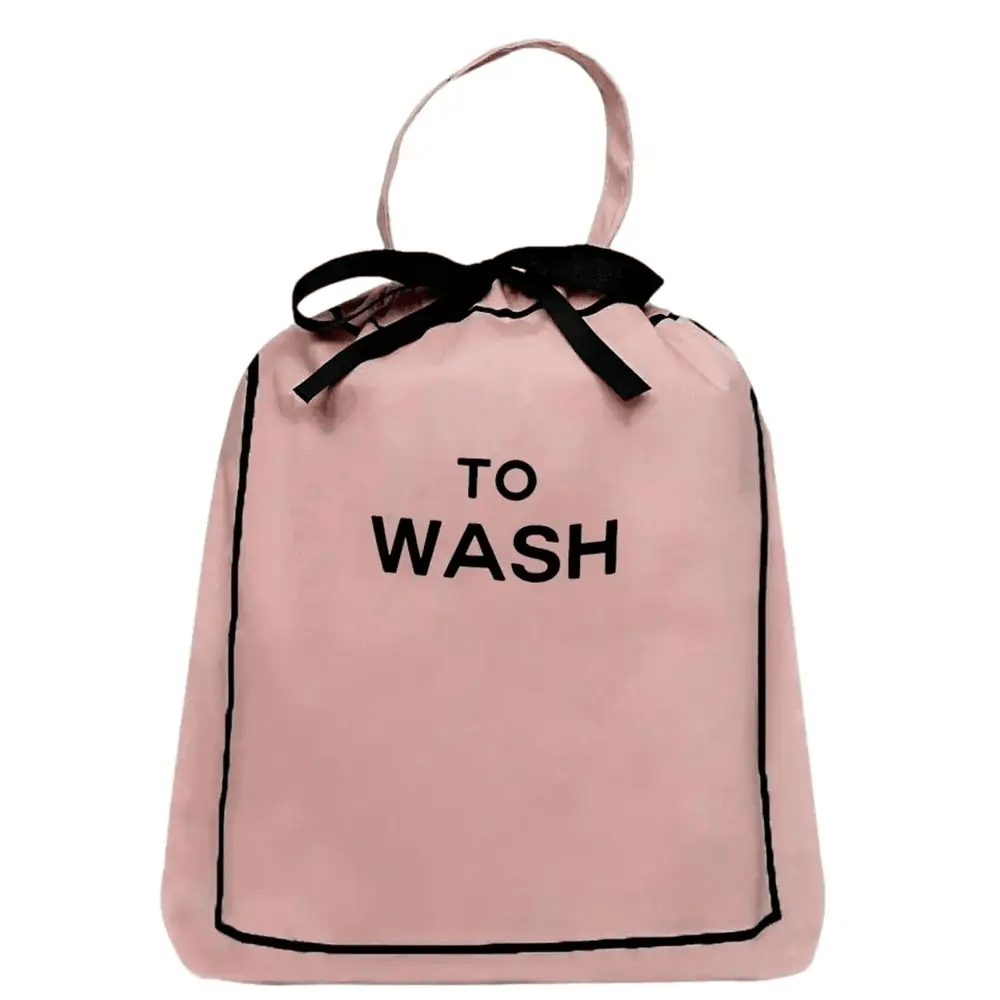 Bag-all To Wash Laundry Bag in pink cotton with black text and bow, featuring drawstring closure and hanging handle for convenient closet organization