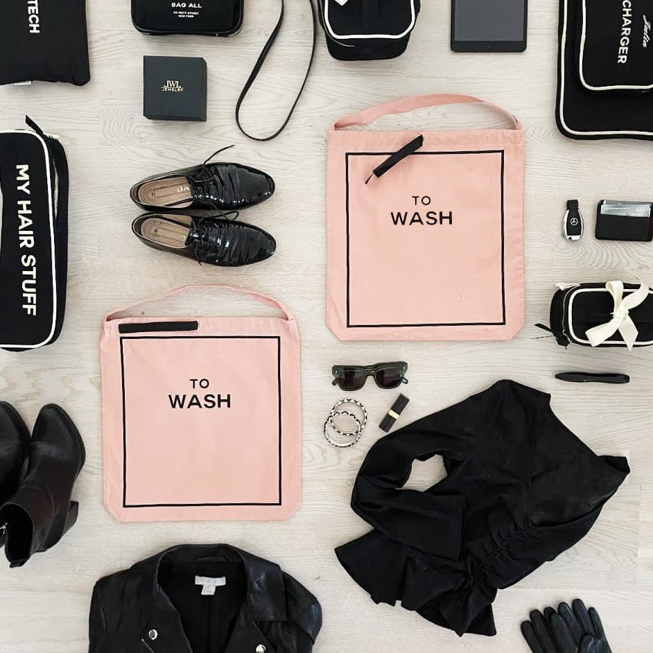 Bag-all pink blush 3-pack laundry and beauty cases styled with fashion accessories flat lay