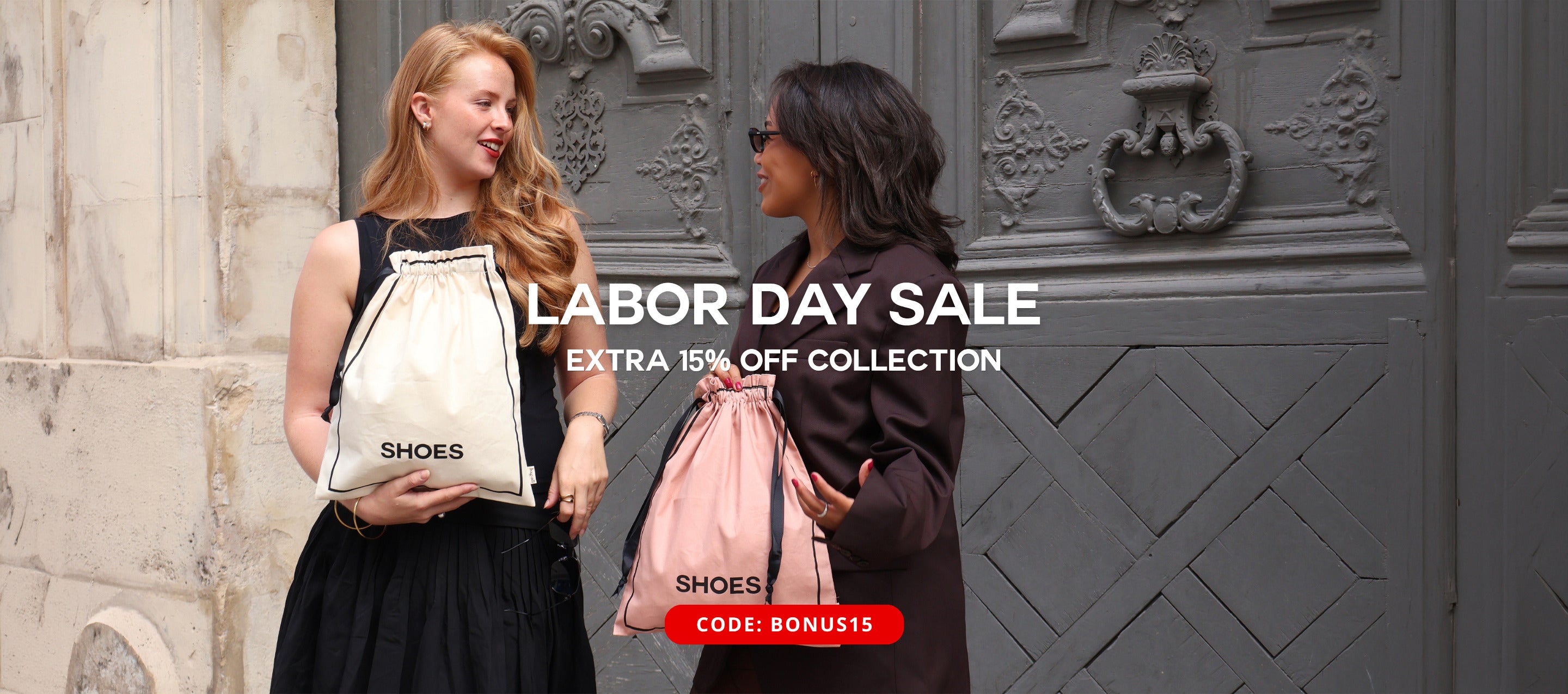 Bag-all women holding personalized cotton shoe bags outside a decorative doorway for stylish travel organization
