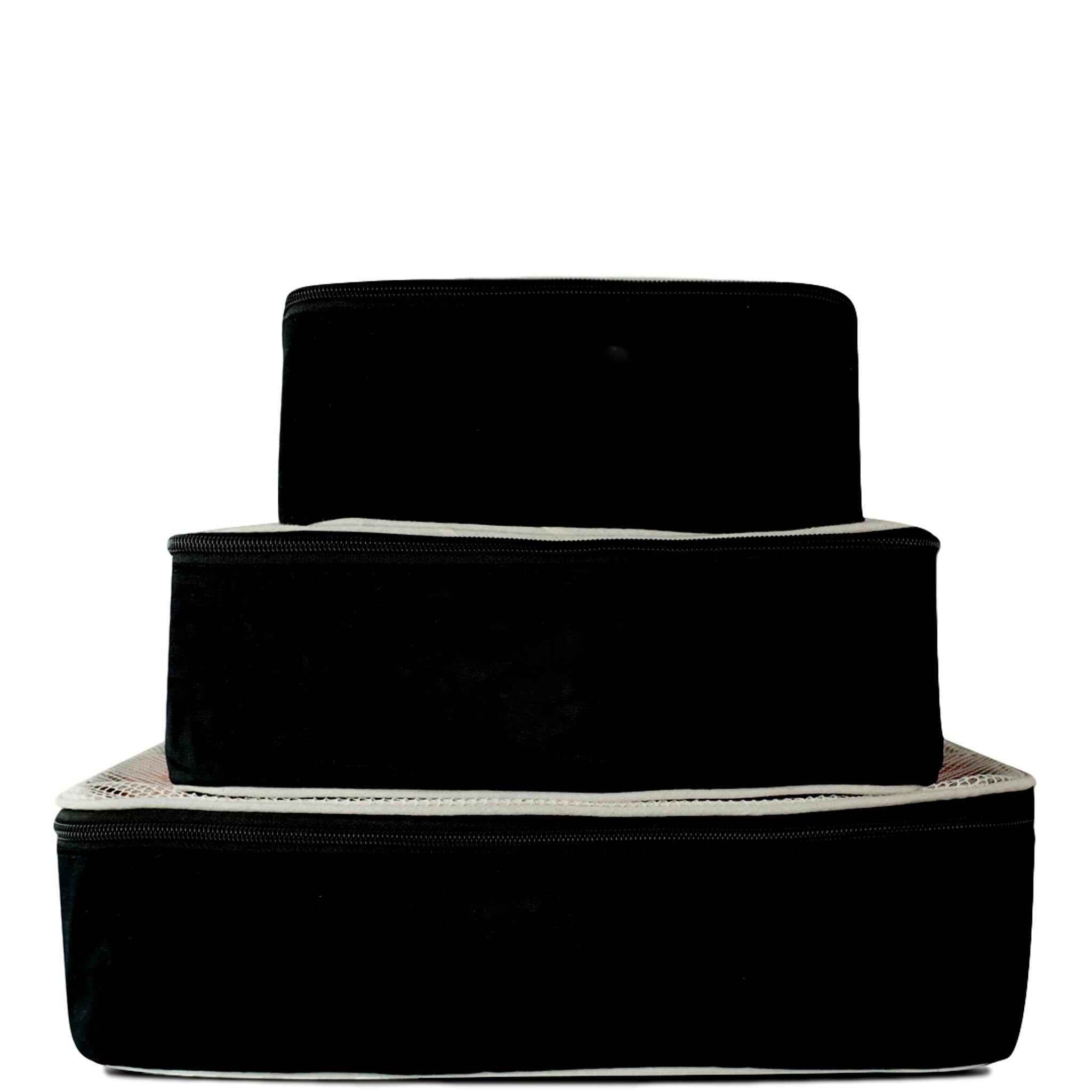 Bag-all Travel Glam 4-Pack: Black cotton organizer set featuring stackable cases for clothing, lingerie, makeup, and tech accessories. Premium travel organization solution.