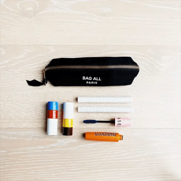 Bag-all Small Makeup Bag in Black with essential cosmetics layout - compact cotton makeup organizer with zipper closure, perfect for daily essentials and travel