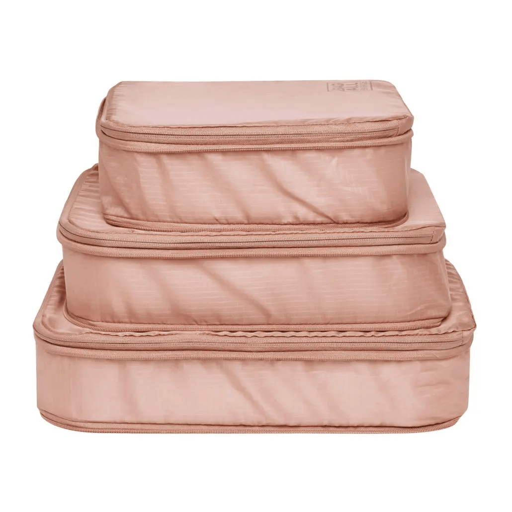 Bag-all Pink Compression Cubes & Packing Bags Set featuring 8 eco-friendly nylon organizers in graduated sizes for efficient travel storage and clothing compression