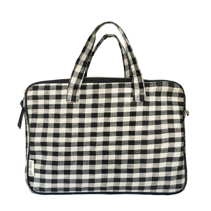 Bag-all Laptop Case 13" in black and white gingham pattern with dual handles, padded protection and front charger pocket. Stylish linen sleeve with crossbody option.