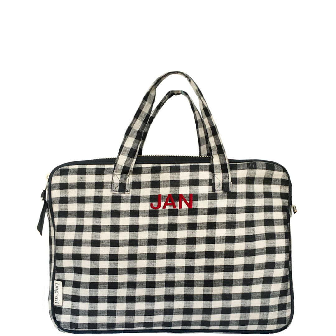 Bag-all Laptop Case 13 in black and white gingham pattern with red monogram, featuring padded protection, front charger pocket and dual carry handles