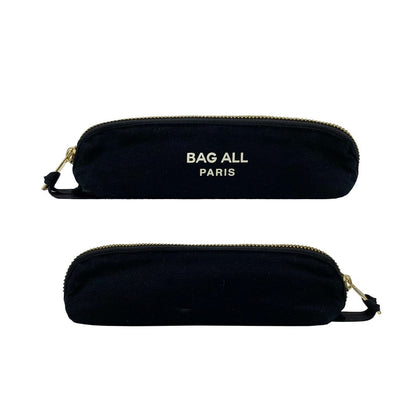 Bag-all Small Makeup Bag in black cotton with gold zipper closure, featuring white Bag-all Paris logo, sleek cylindrical design for compact cosmetic storage