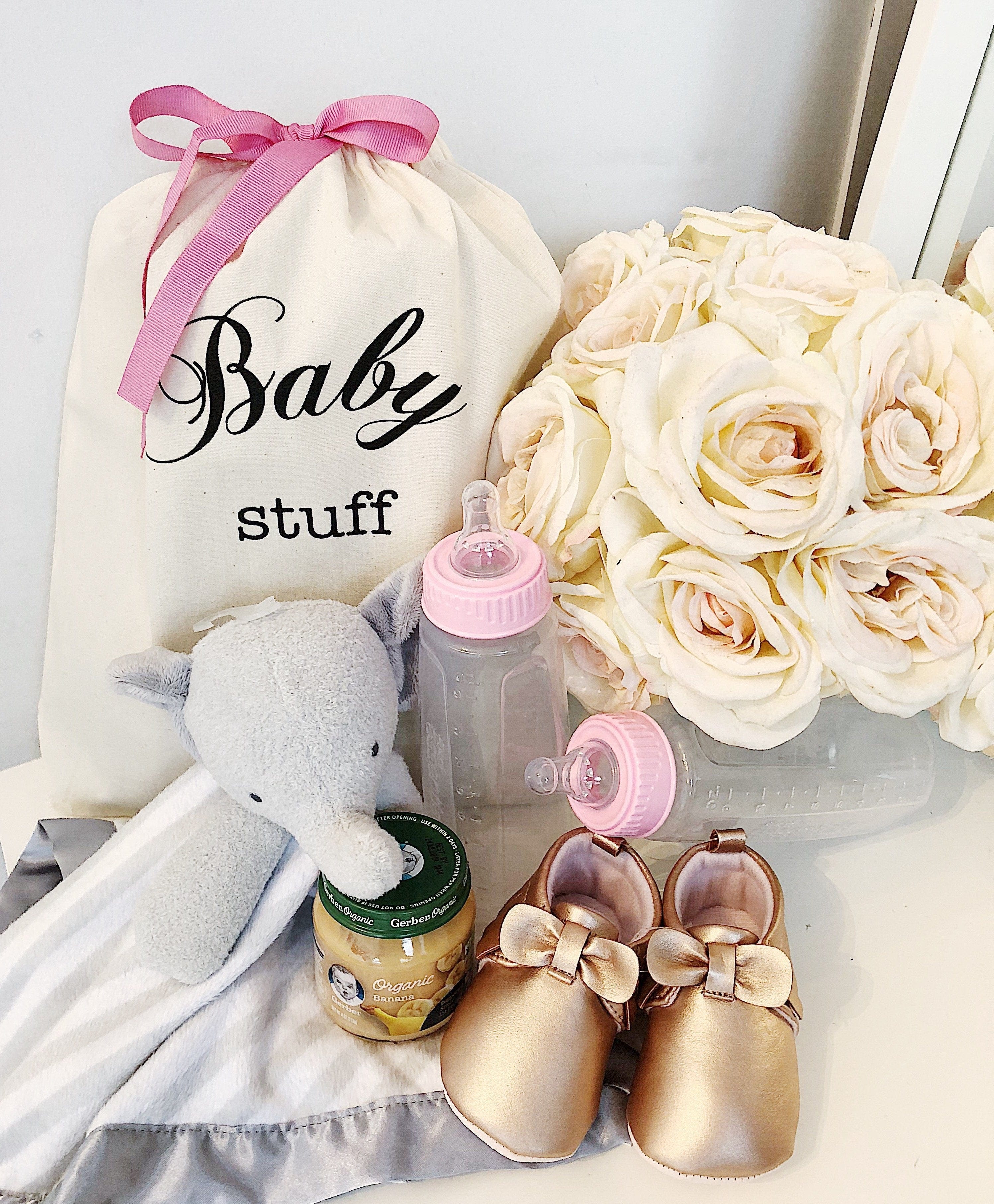 Pink baby stuff and a baby organizing bag. 