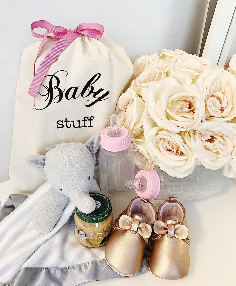 
                                      
                                        Pink baby stuff and a baby organizing bag. 
                                      
                                    