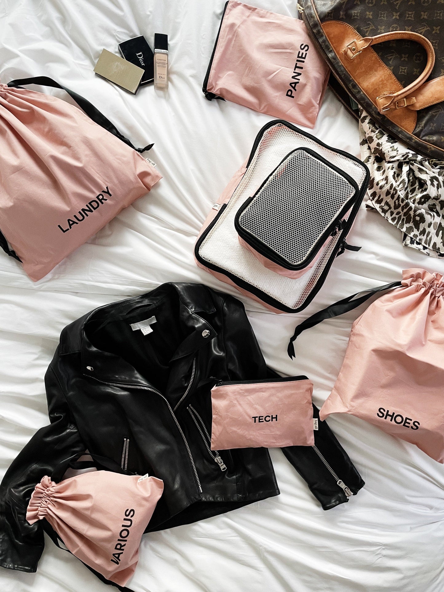 Bag-all BA Travel Set, 8-Pack in Pink/Blush. Stylish packing organizers including laundry, shoes, socks, tech, and various pouches for travel