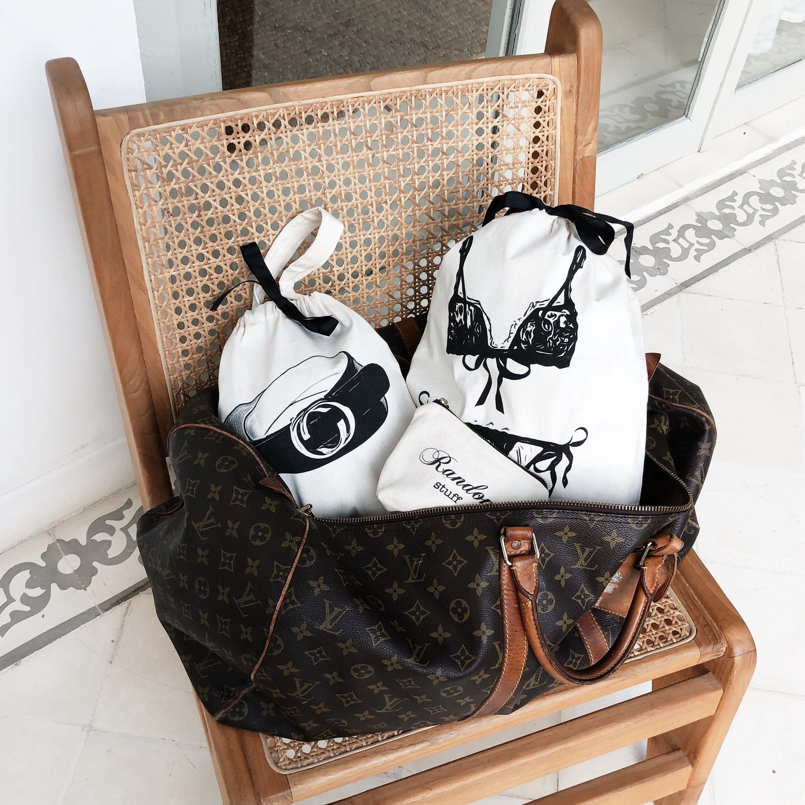A duffle with travel organizing bags for a weekend getaway. 