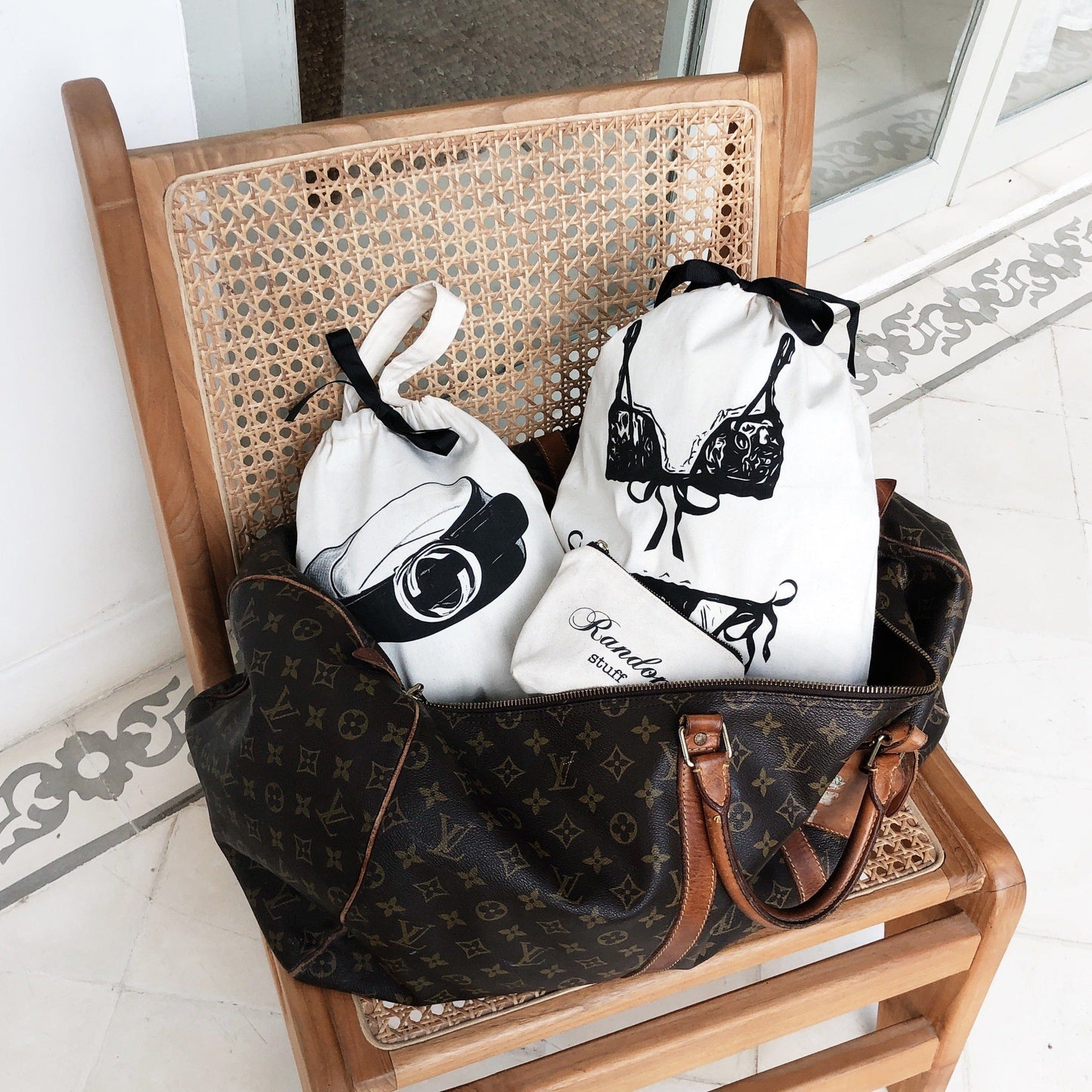 
                                      
                                        A duffle with travel organizing bags for a weekend getaway. 
                                      
                                    