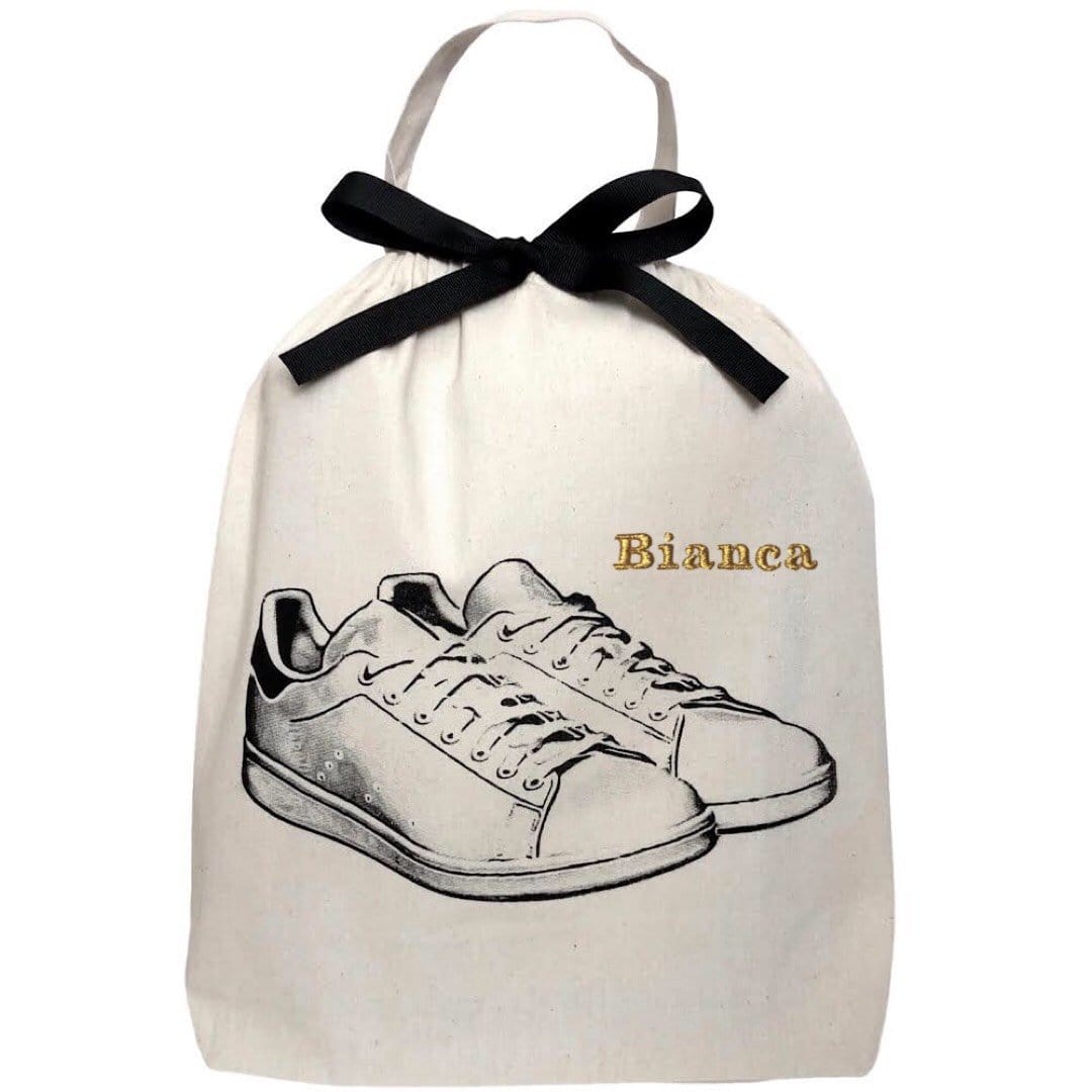 White Sneaker Shoe Bag with monogram on the top right. 