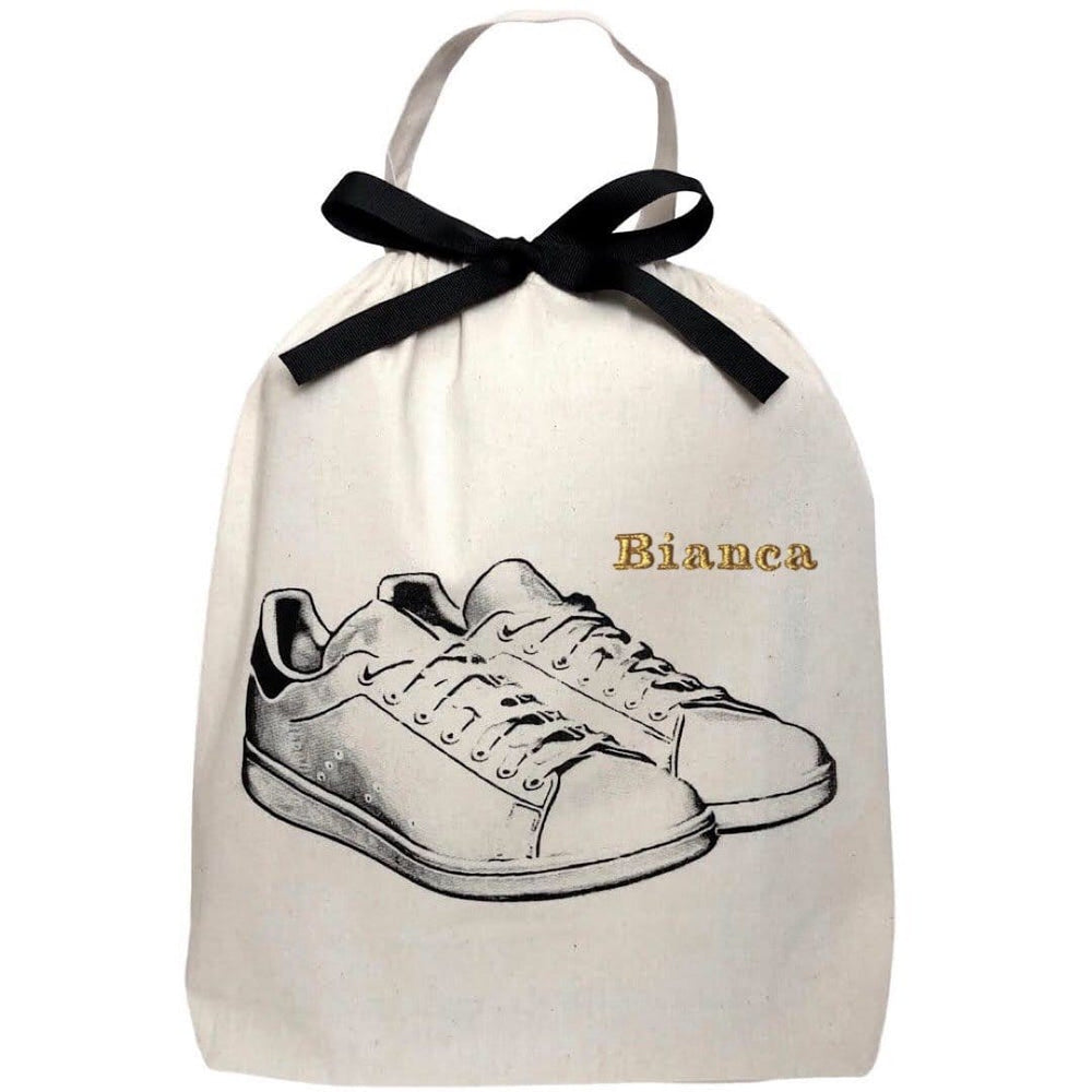 
                                      
                                        White Sneaker Shoe Bag with monogram on the top right. 
                                      
                                    