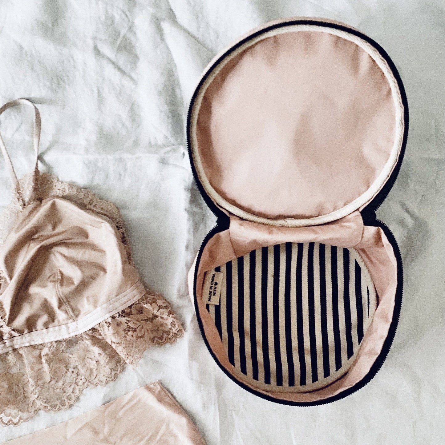 
                                      
                                        Round Lingerie Case Pink inside view, pj set top
                                      
                                    