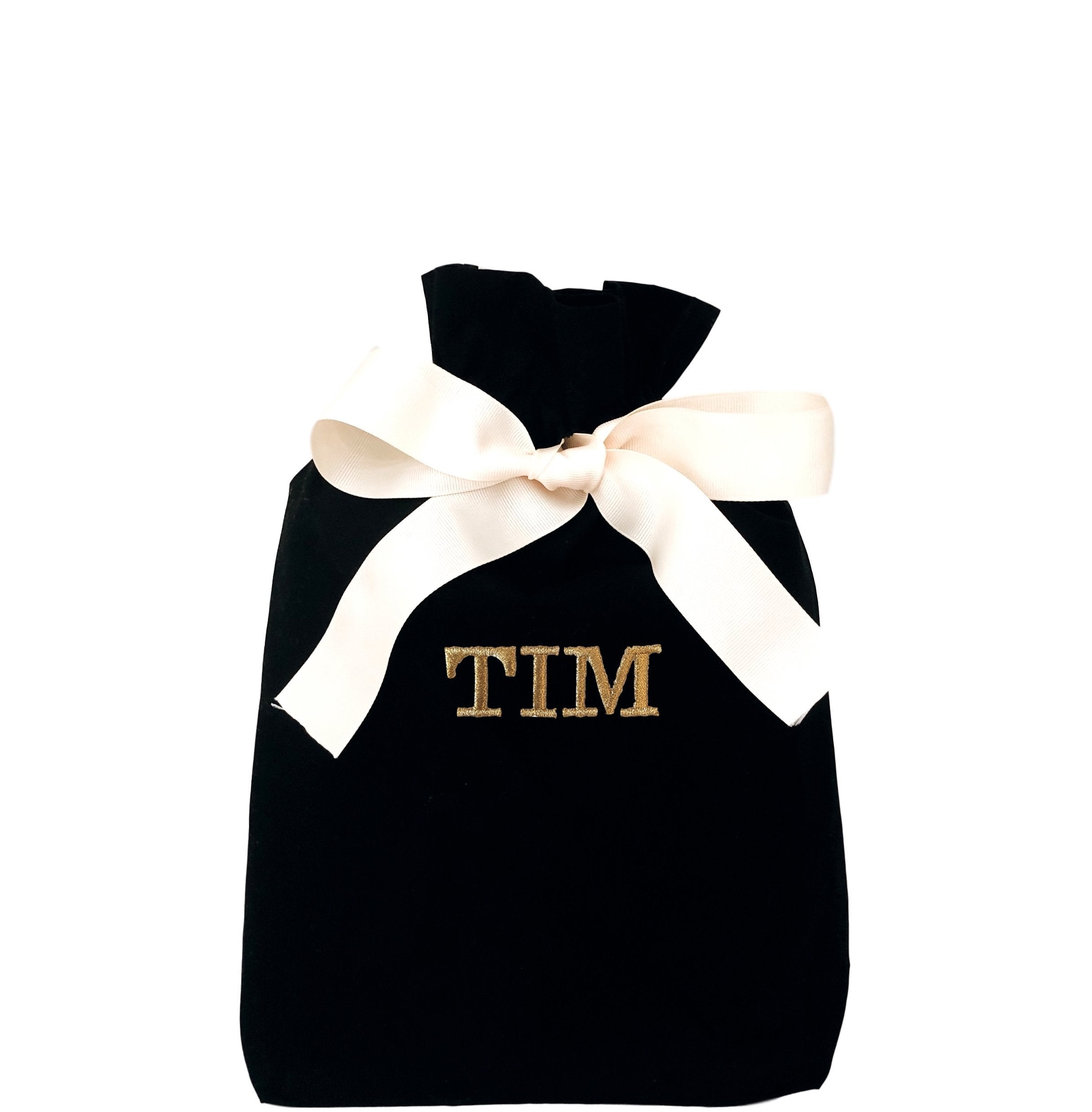 A black reusable gift bag with "TIM" printed on the front. 