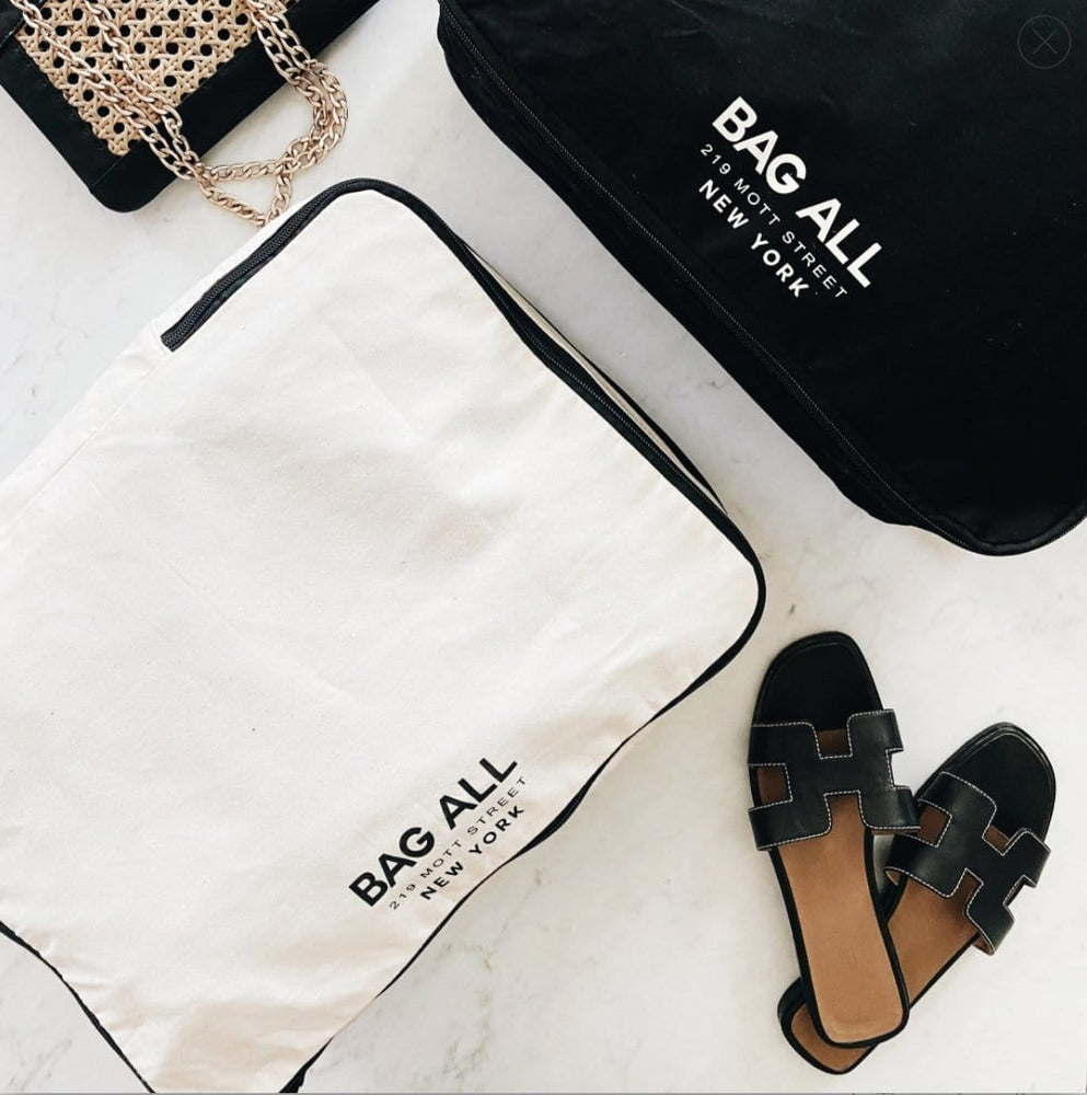 
                                      
                                        white and black double sided packing cubes. 
                                      
                                    