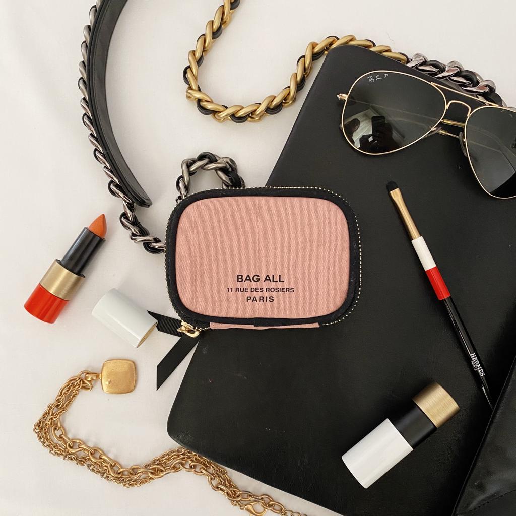 
                                      
                                        Pink wallet for holding cards and money. 
                                      
                                    