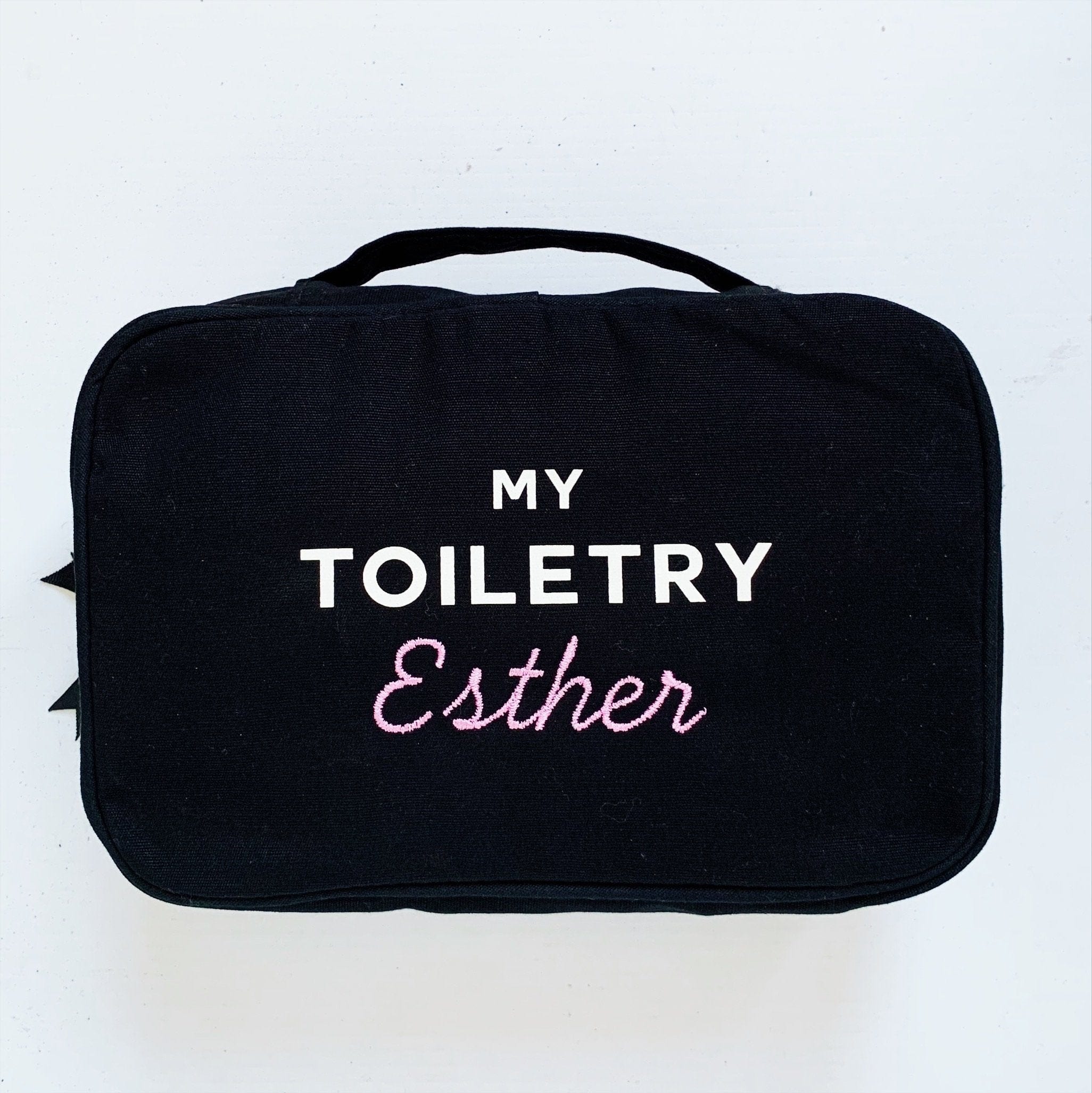 My toiletry case with "Esther" monogrammed on the front. 
