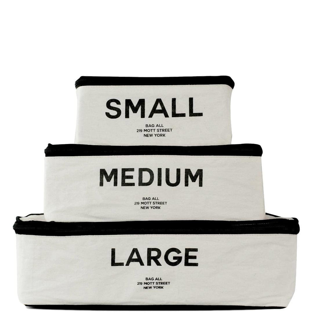 White packing cubes in small medium and large. 